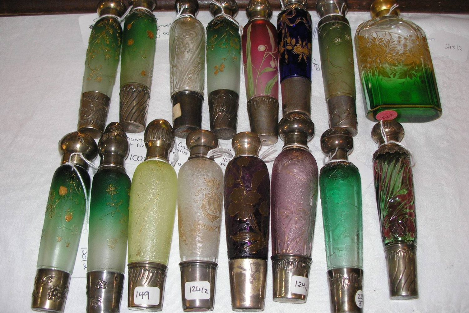 Row of colorful vintage glass perfume bottles